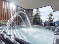 Appartement L'Orée du Bois met buiten-whirlpool-3